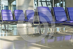 Row of purple chair decoration at airport terminal waiting area interior for modern building