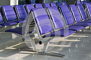 Row of purple chair decoration at airport terminal waiting area interior for modern building