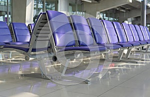 Row of purple chair interior at airport terminal waiting area decoration for modern building