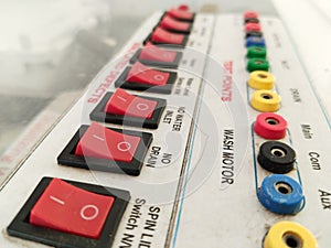 row of Red power switches in on off position with Rca connector with his connection name, black frame mains supply symbol