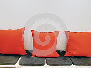 Row of Red Soft Pillows and Cushioning Seats