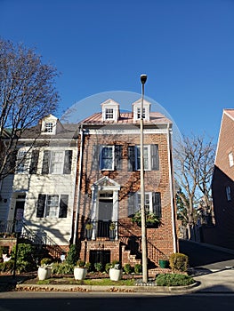 row of residential townhouses. Concept of real estate development, the housing market, and homeownership