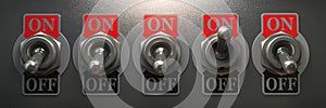 Row of retro toggle switch in OFF position and one in ON position on metal background