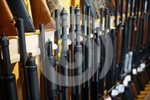 Row of rifles in gun shop closeup, nobody
