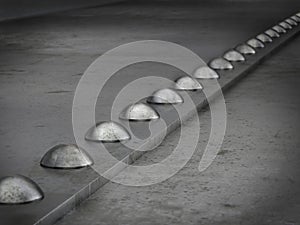 Row of rivets on the metal grunge background