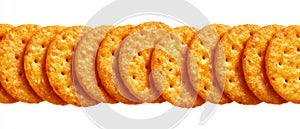 Row of round golden crackers on white background