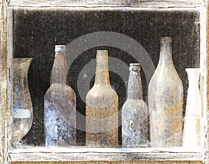 A row of rustic antique glass bottles.