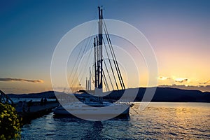 Row of sailboats docked along the coastal port city of Volos in Thessaly, Greece