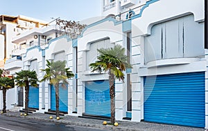 Row of self storage units with over head doors.. Row of garage doors at area for townhouses