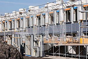 Row of semi-detached houses under construction in a new residential area