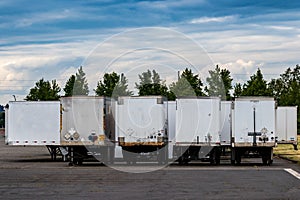 Row of semi tractor trailers