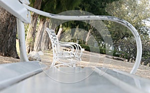 Row of several white benches