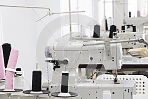 A row of sewing machine in tailor workplace