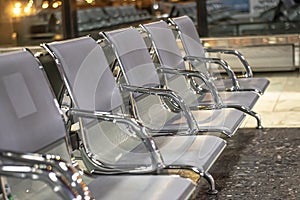 A row of shiny chairs in the waiting room