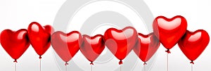 A row of shiny red heart-shaped balloons isolated on white background. Valentine’s Day concept with glossy heart