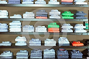 Row of shirts on shelfs