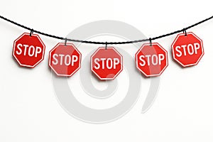 A row of small foot signs on a rope.