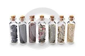 Row of small glass bottles with different spices