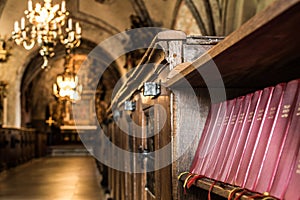 Row of songbooks in an old church.