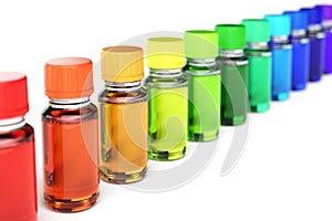 Row of sorted dropper bottles in spectrum colors