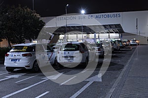 Row of Spanish cabs parked in the cab parking lot at Madrid`s south bus station