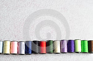 A row of spools sewing threads