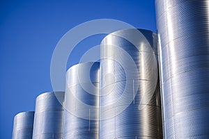 Row of stainless steel fermentation wine tanks
