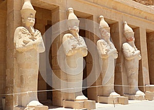 A row of statues of Queen Hatshepsut.