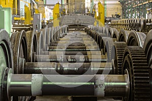 Row of steel wagon train wheels in front of the locomotive