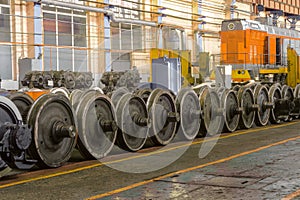 Row of steel wagon train wheels in a repair depot