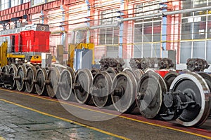 Row of steel wagon train wheels in a repair depot