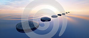 Row of stones in calm water in the wide ocean