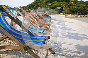 Row of sun beds in the beach of Nang Yuan