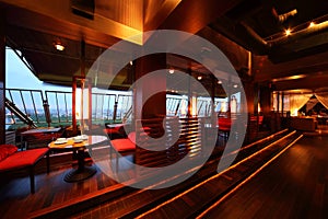 Row of tables and seats in empty cozy restaurant