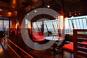 Row of tables and seats in empty restaurant