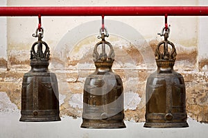A row of three buddhism big bell in thai temple