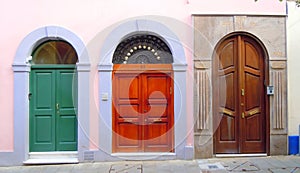 A row of three different arched doors