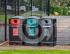 Row of three recycling bins