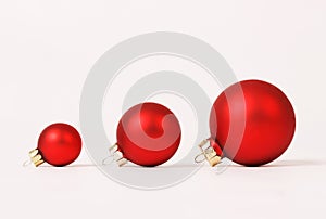 Row of three red matt different sizes christmas balls