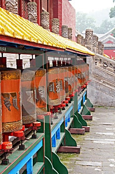 Row of Tibetan prayer-wheels in Chengde, China
