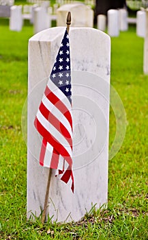 Row of tombstones with american flag