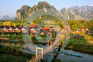 Row of tourist bungalows along Nam Song River in Vang Vieng, Vie