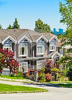 A row of townhouses on street in suburban of New Westminster, British Columbia.