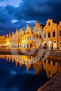 Row of traditional houses in the town of TelÃÂ, Czech Republic, at night. photo
