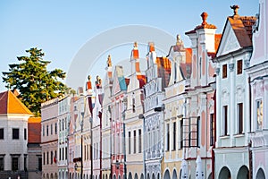 Row of traditional houses in the town of TelÃÂ, Czech Republic, after the sunrise. photo