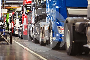 Row of trucks in a production hall