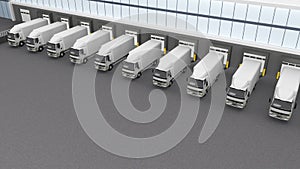 Row of trucks at the warehouse unloading wall