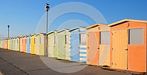 A row of twenty coloourful beach huts