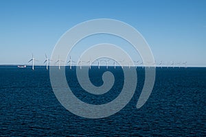 Row of wind turbines in Baltic Sea between Germany and Denmark