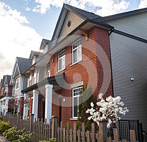 Row of Typical English Terraced Houses. Red brick homes side by side